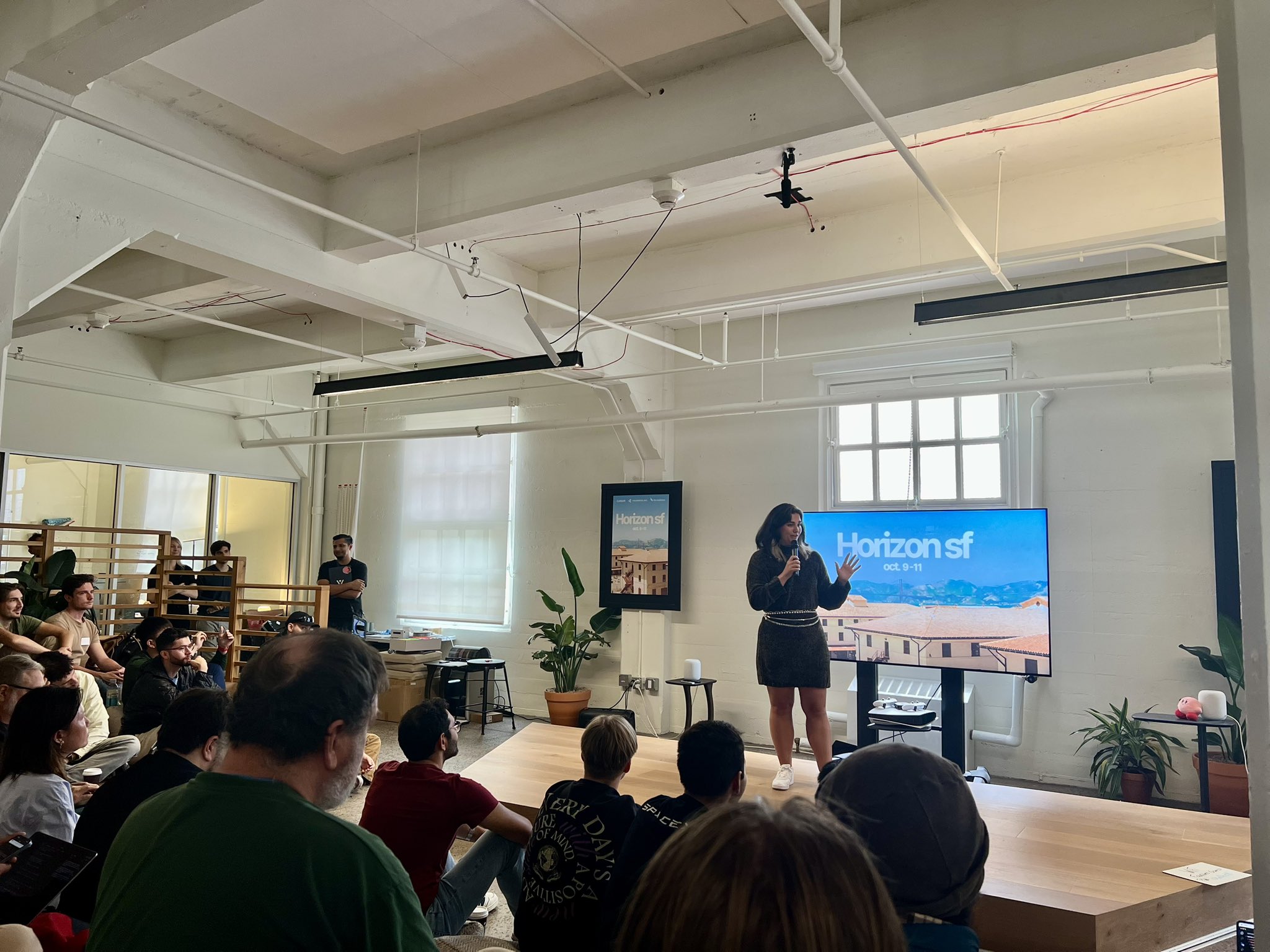 Speaker presenting on stage at a Horizon SF event